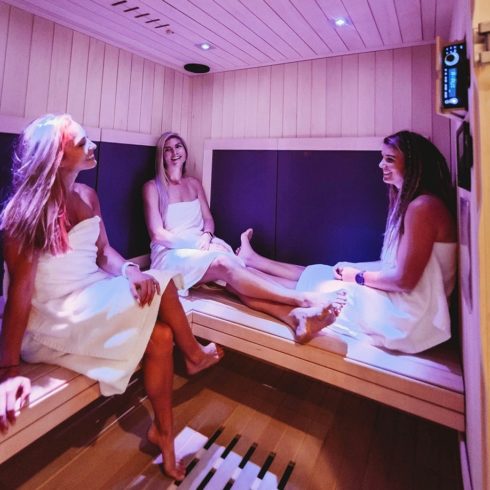 Group of women socializing in Infrared Sauna.
